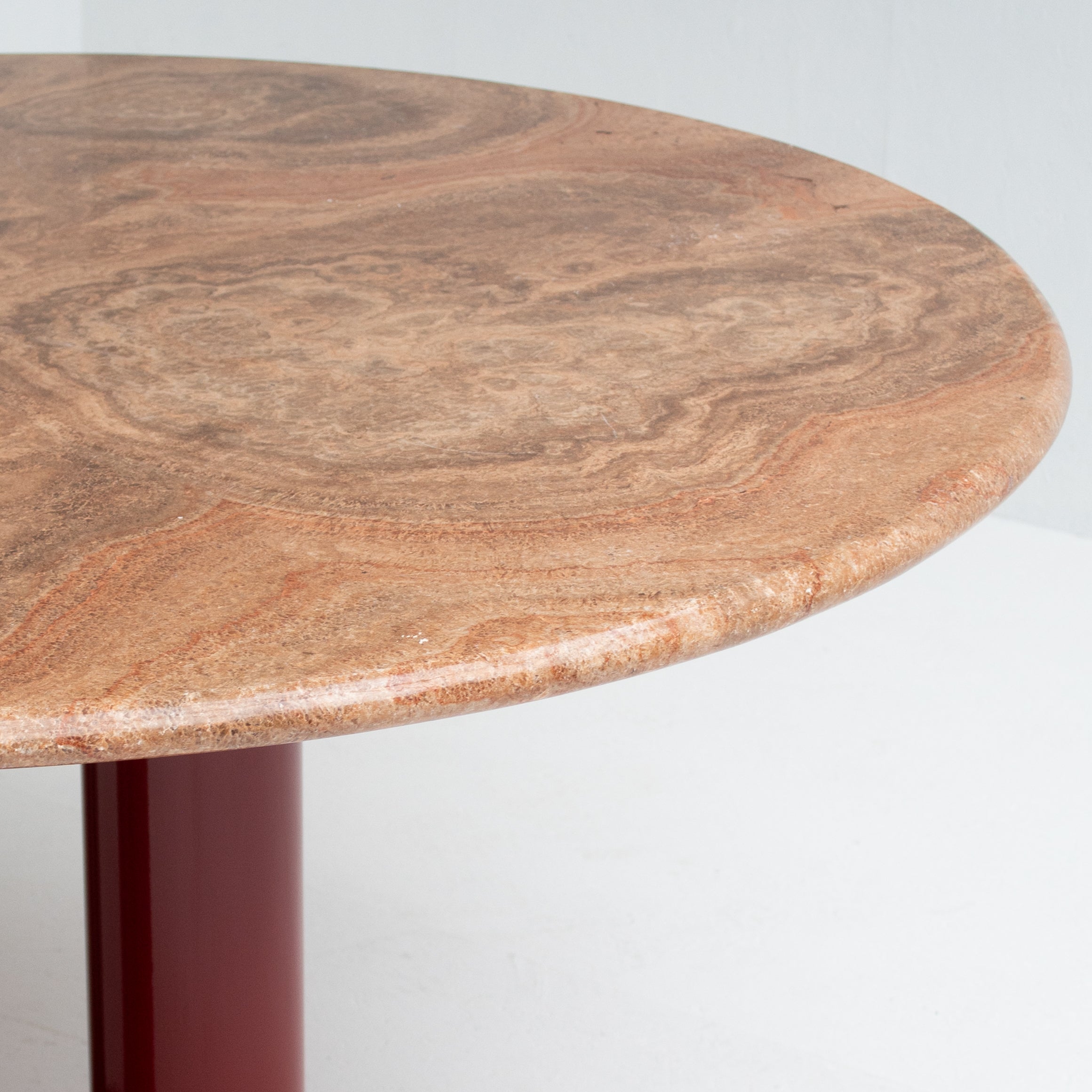 Round Marble Dining Table with Burgundy Lacquered Base — close-up of marble surface and lacquered base