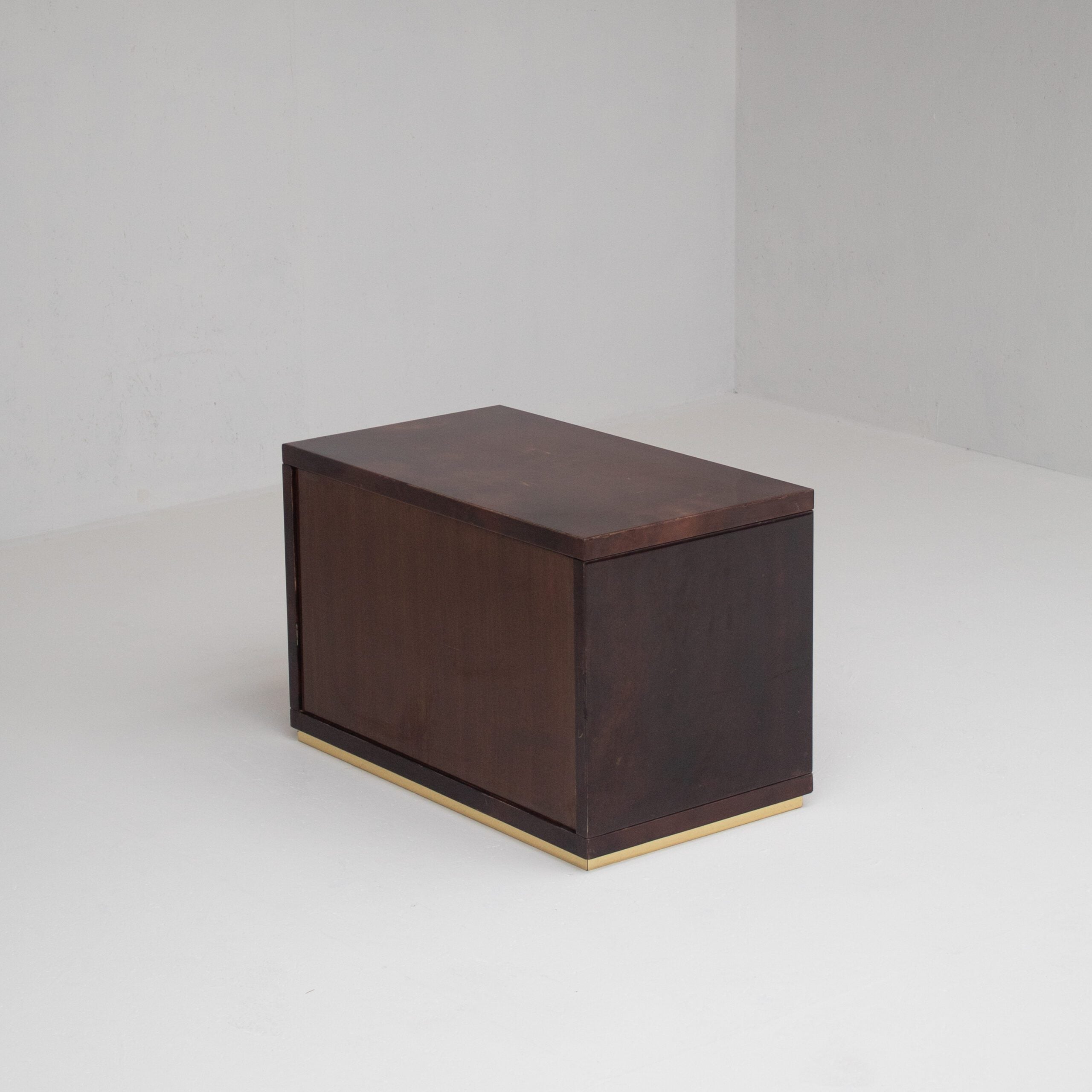 Pair of Aldo Tura (attr) Nightstands in Parchment and Brass — angled view in minimalist setting