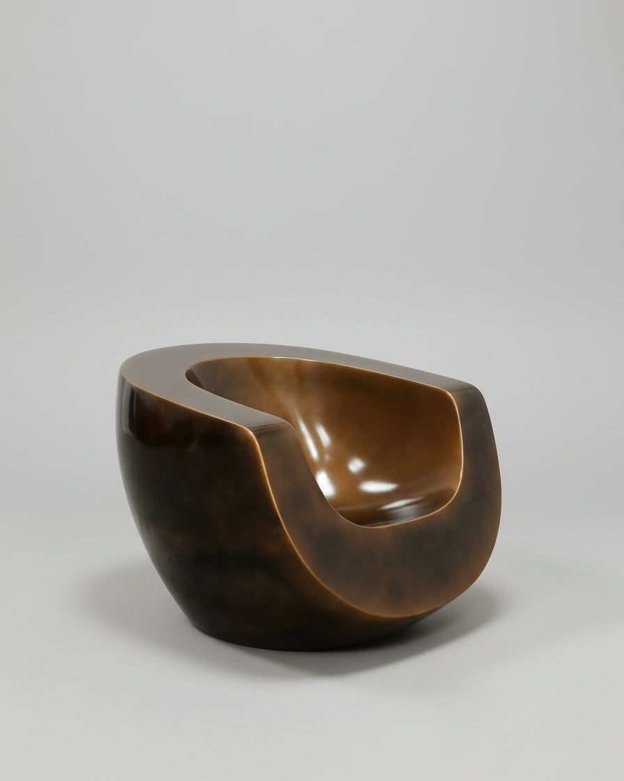 Brown fiberglass Moon chair with curved sculptural form by Mike To