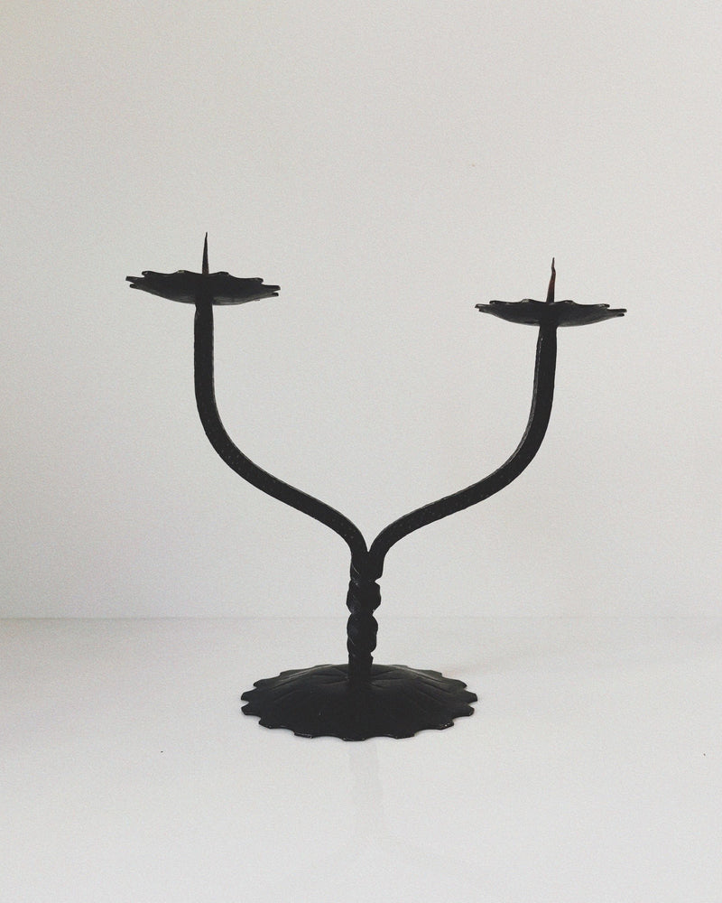 Forged metal two-arm candleholder with twisted stem from Poland