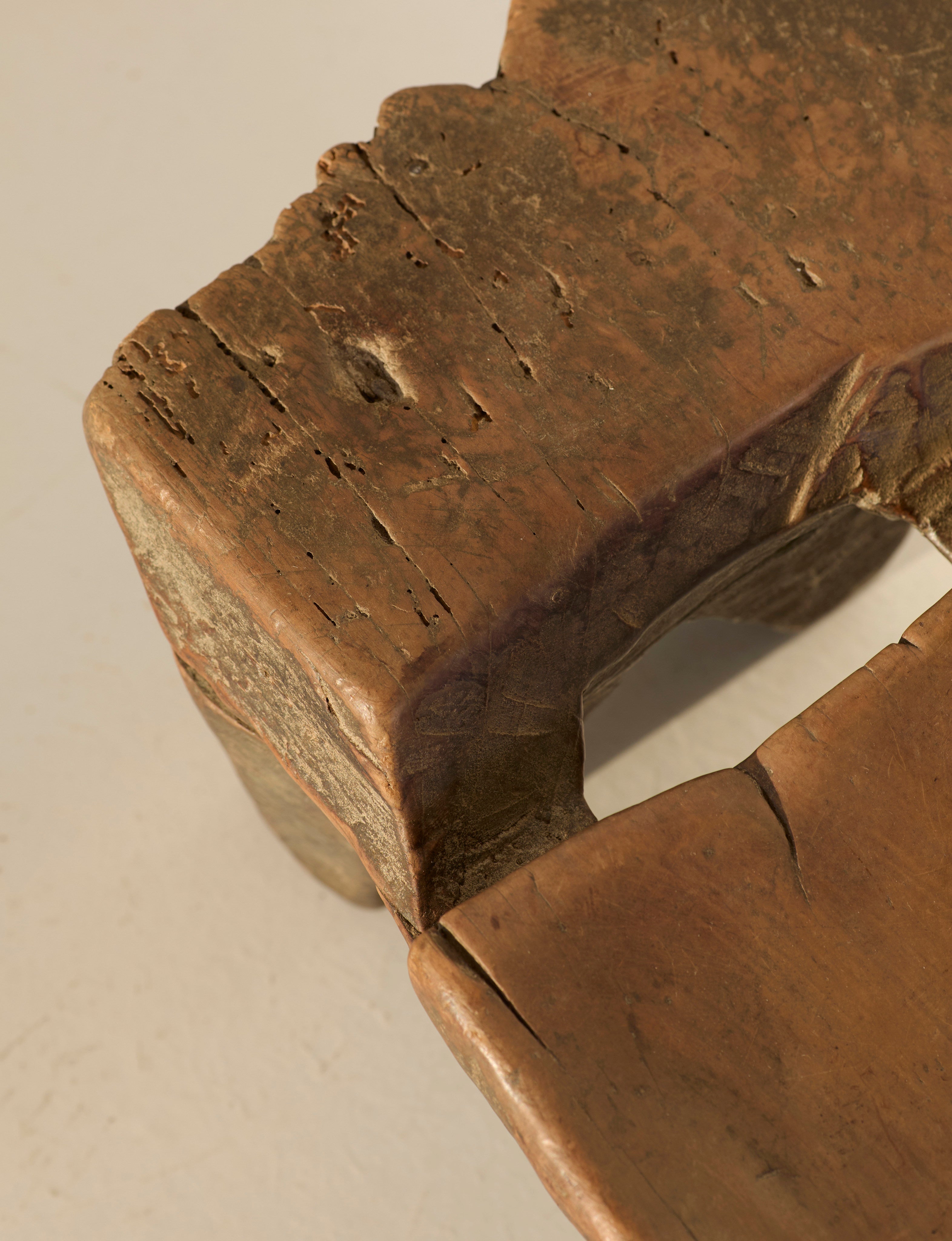 Mid-Century African Senufo Stool in solid wood — close-up of textured seat edge