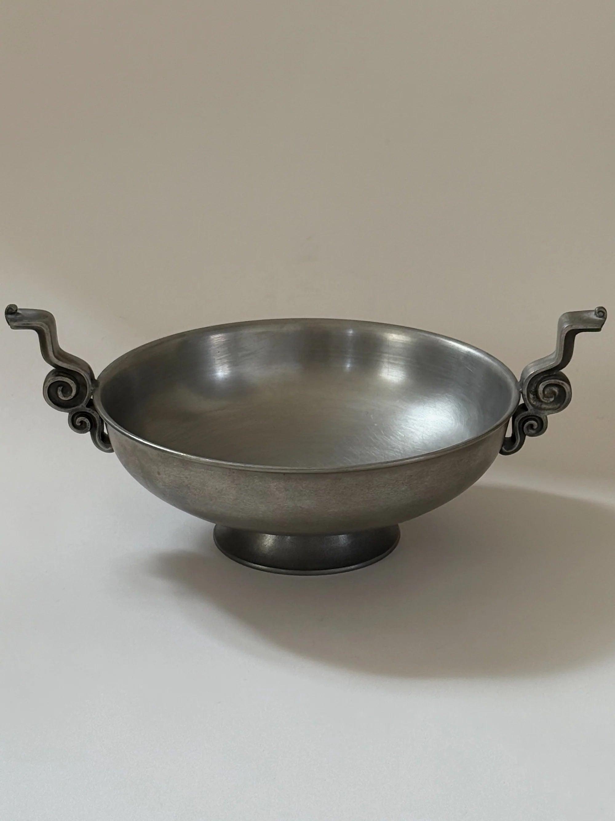 Pewter Bowl with Scroll Handles Edvin Ollers, 1952 — side angle showing smooth metallic finish