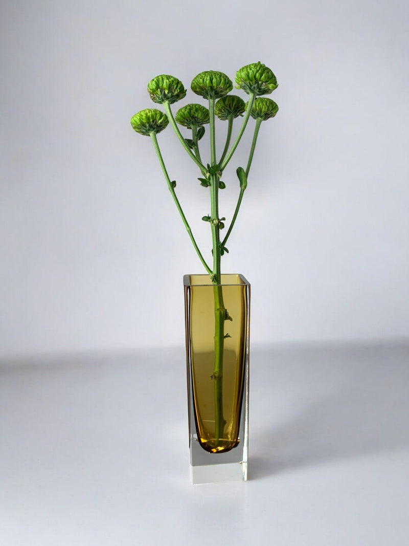 Yellow Sommerso vase, Murano Glass, Italy, 1970 — close-up with green flowers in vase