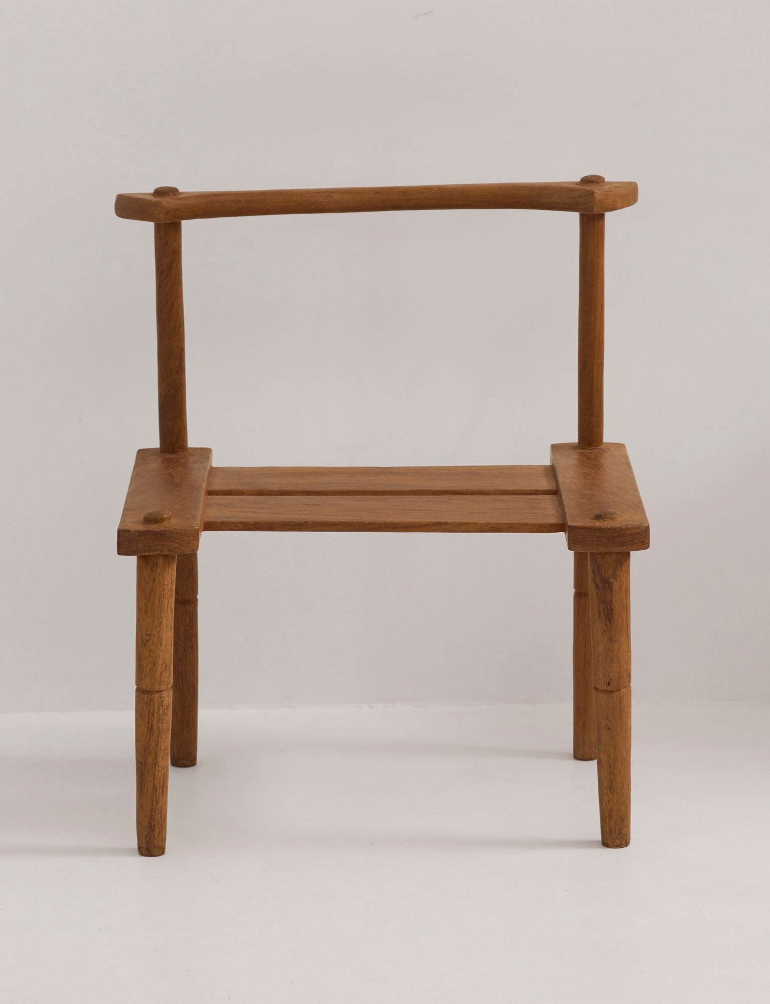 Large one-of-a-kind Baoulé chair in solid wood — lifestyle setting