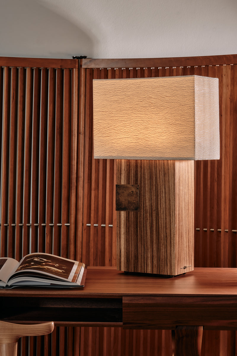 Pollux wooden table lamp with textured shade on modern desk