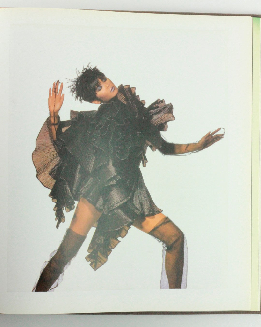 Appearances — top view of model in layered black outfit