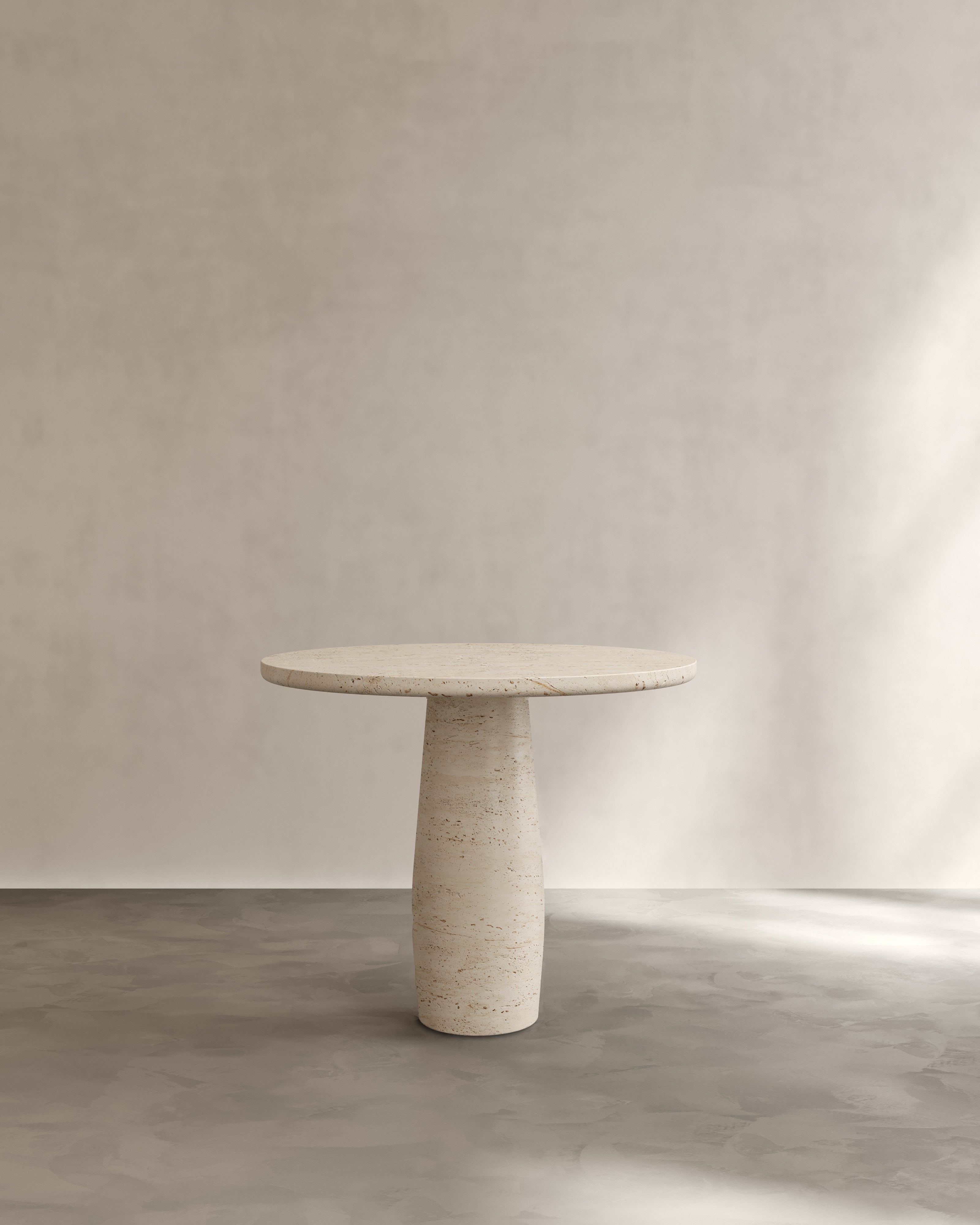 Raffaella Table I — front view of round stone dining table