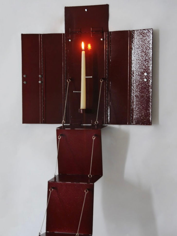 Wax Clock' Wall Candleholder — red metal holder with candle lit