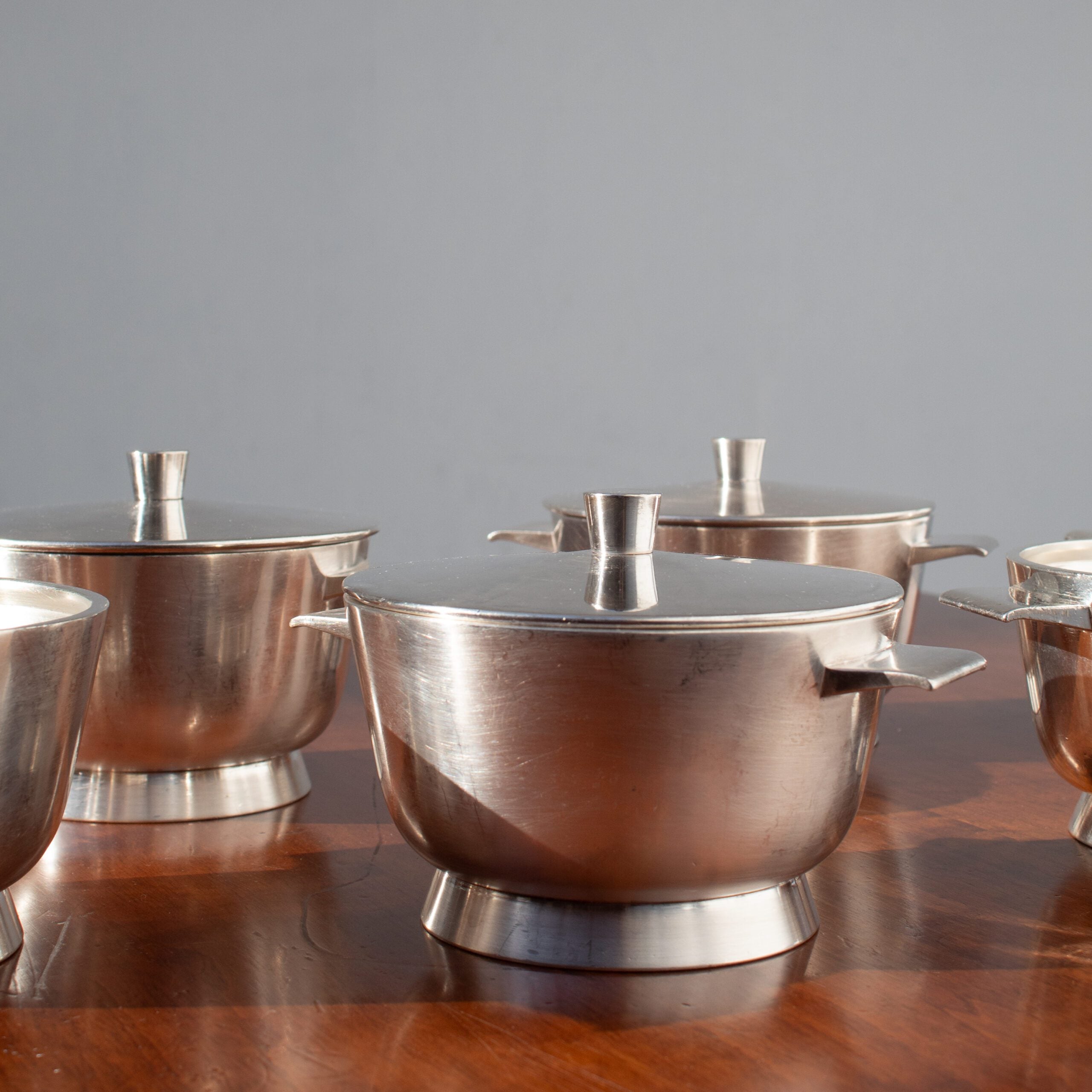 Arthur Krupp Milano Silver Plated Bowls Set — top view of polished silver bowls on wooden table