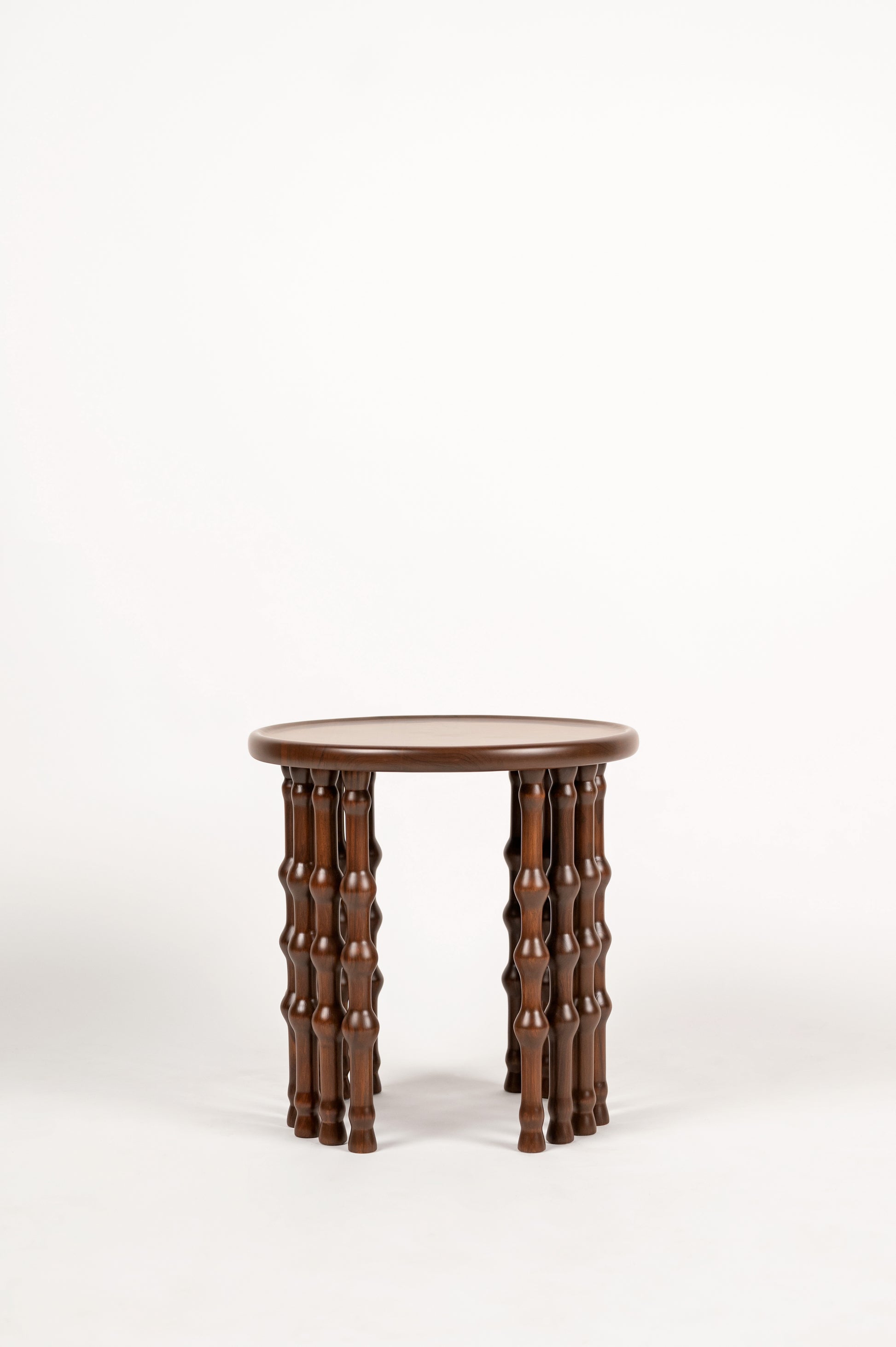 Arcus Side Table — front view with brown wooden legs