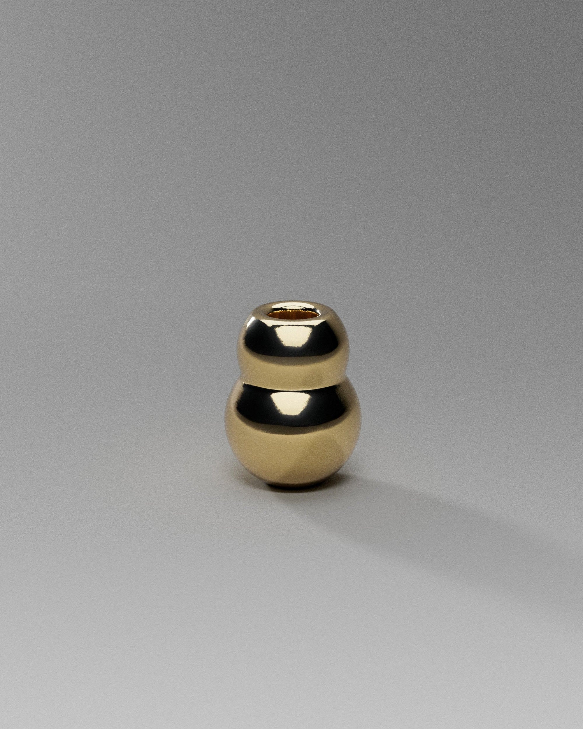 ANJOU Candleholder — top view of polished gold surface