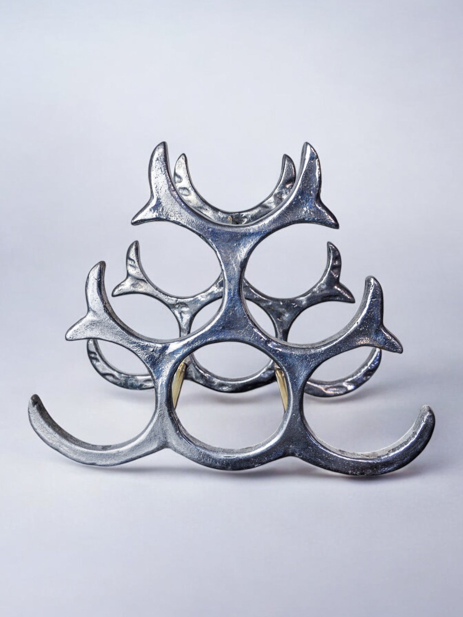 Brutalist bottle rack by Art3, Spain, 1980s — side angle showing metallic finish