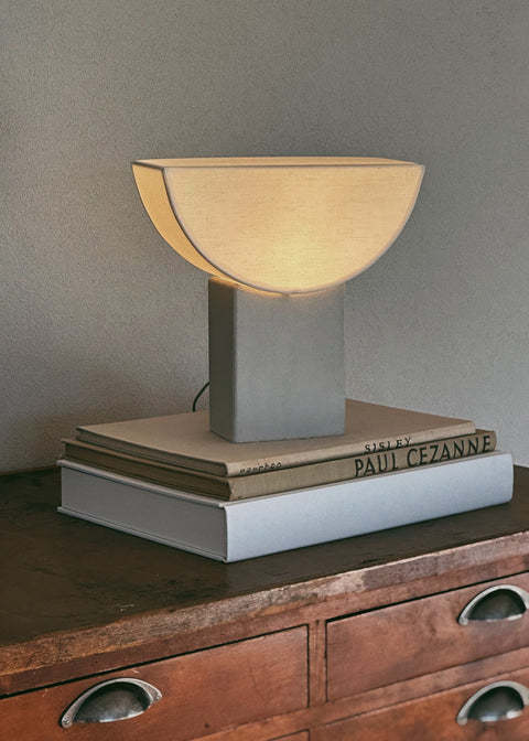 Reminder (001) – Table Lamp – Tall — close-up of fabric shade on concrete base