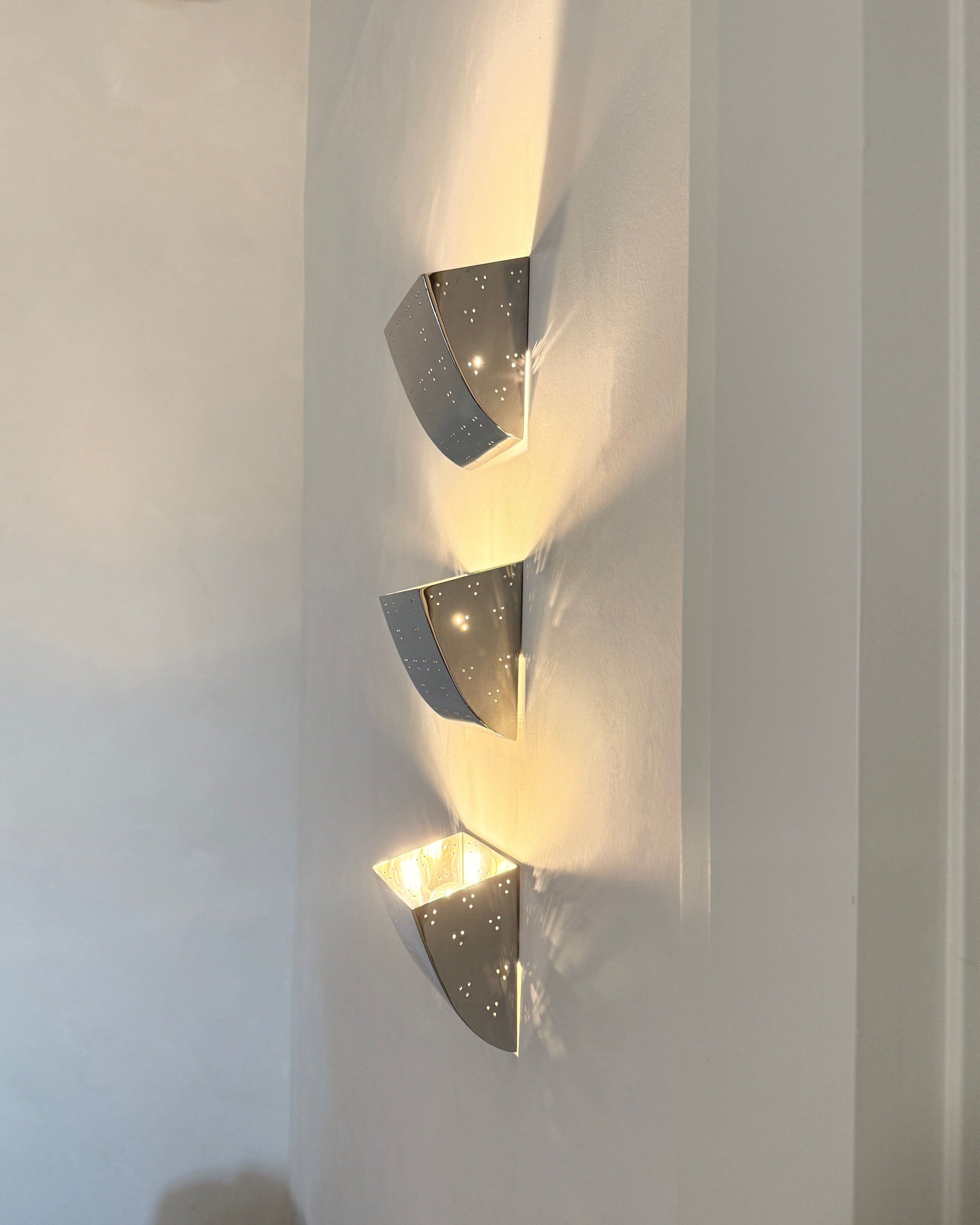 Jolene Wall Lamp - Polished Steel — back view showing light pattern on wall