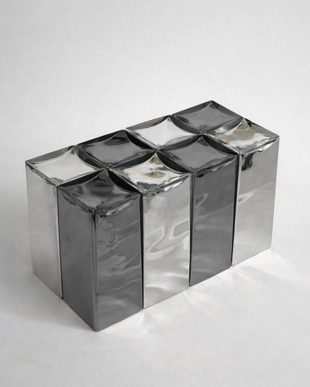MONOLIT' Bench — side angle showing reflective metal surface