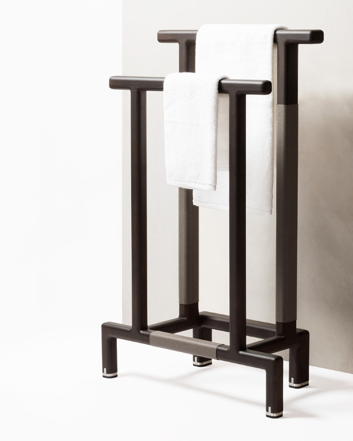 Lloyd Tabi dark bronze towel rack with four vertical bars and white towel