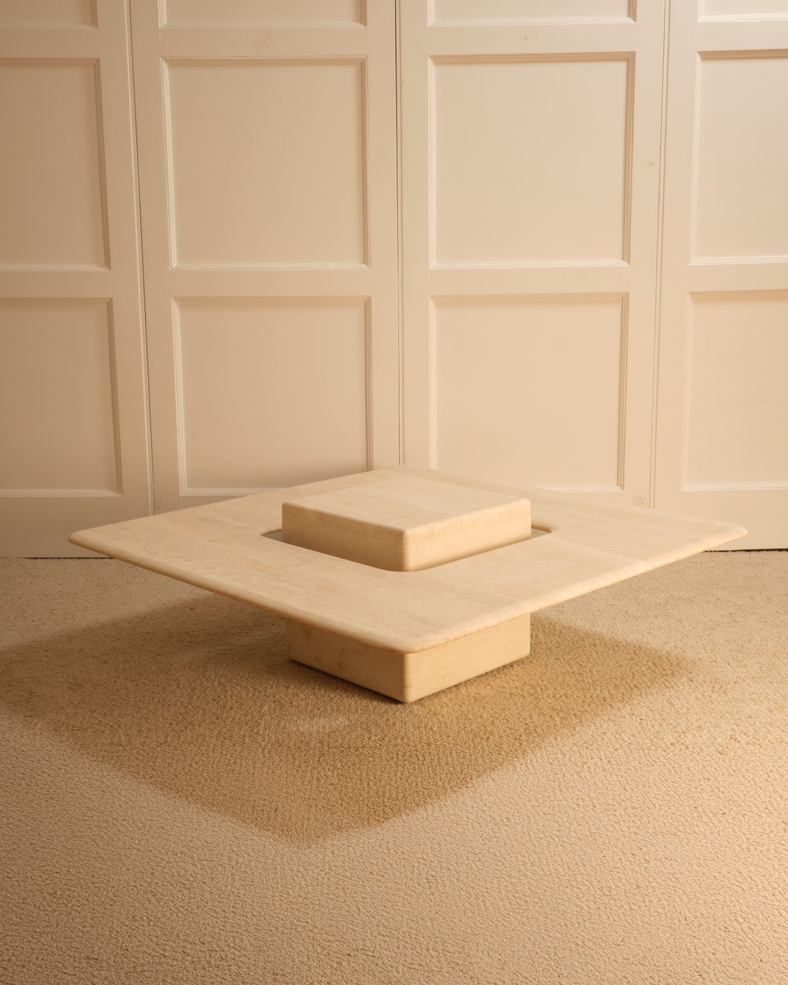 Saturn travertine coffee table with geometric stacked design