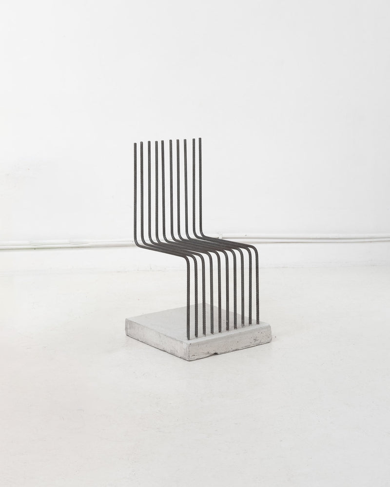 Postmodern steel rod chair with concrete base by Heinz Landes