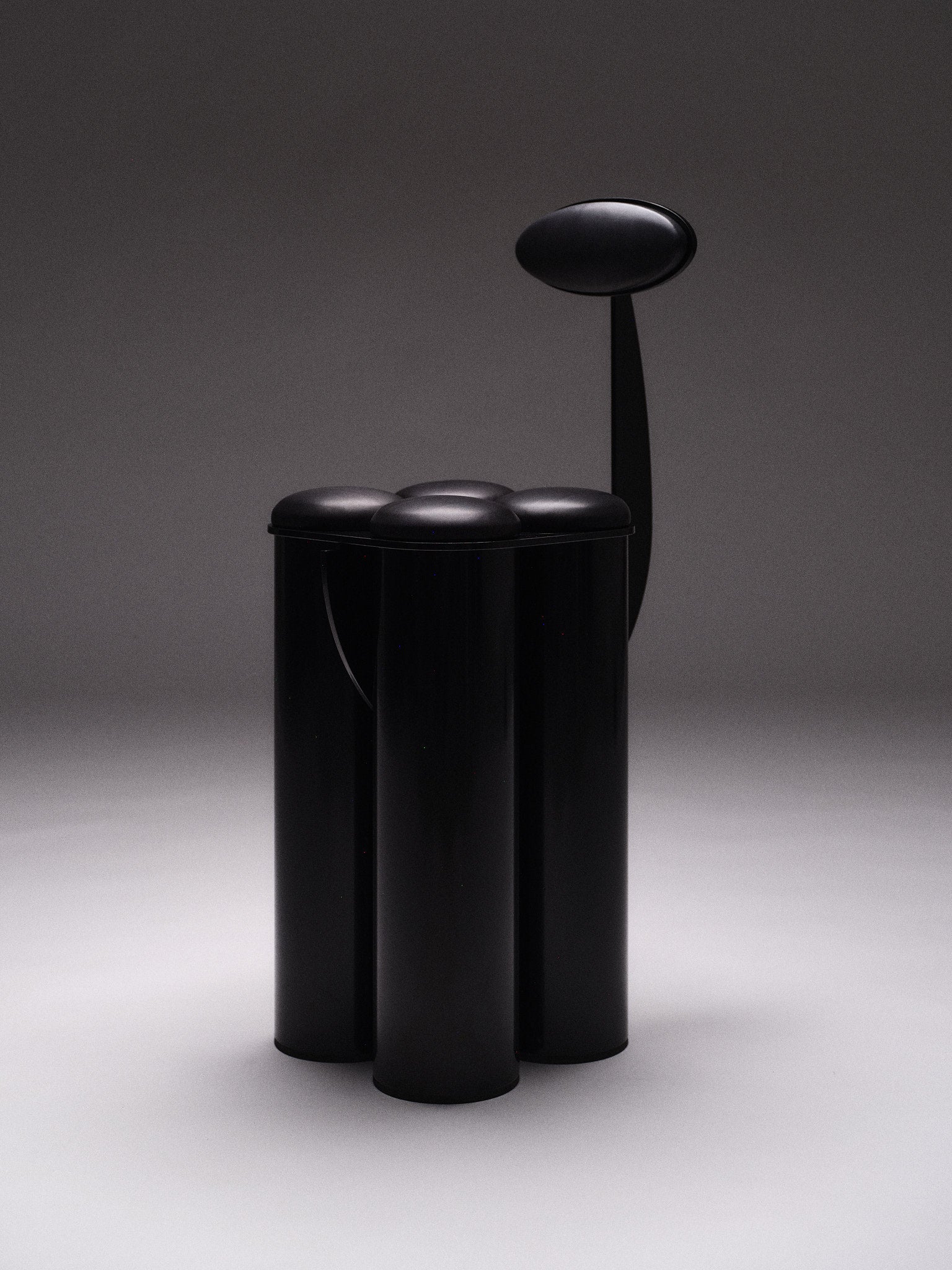 Giulio Stool — angled view highlighting black glossy finish