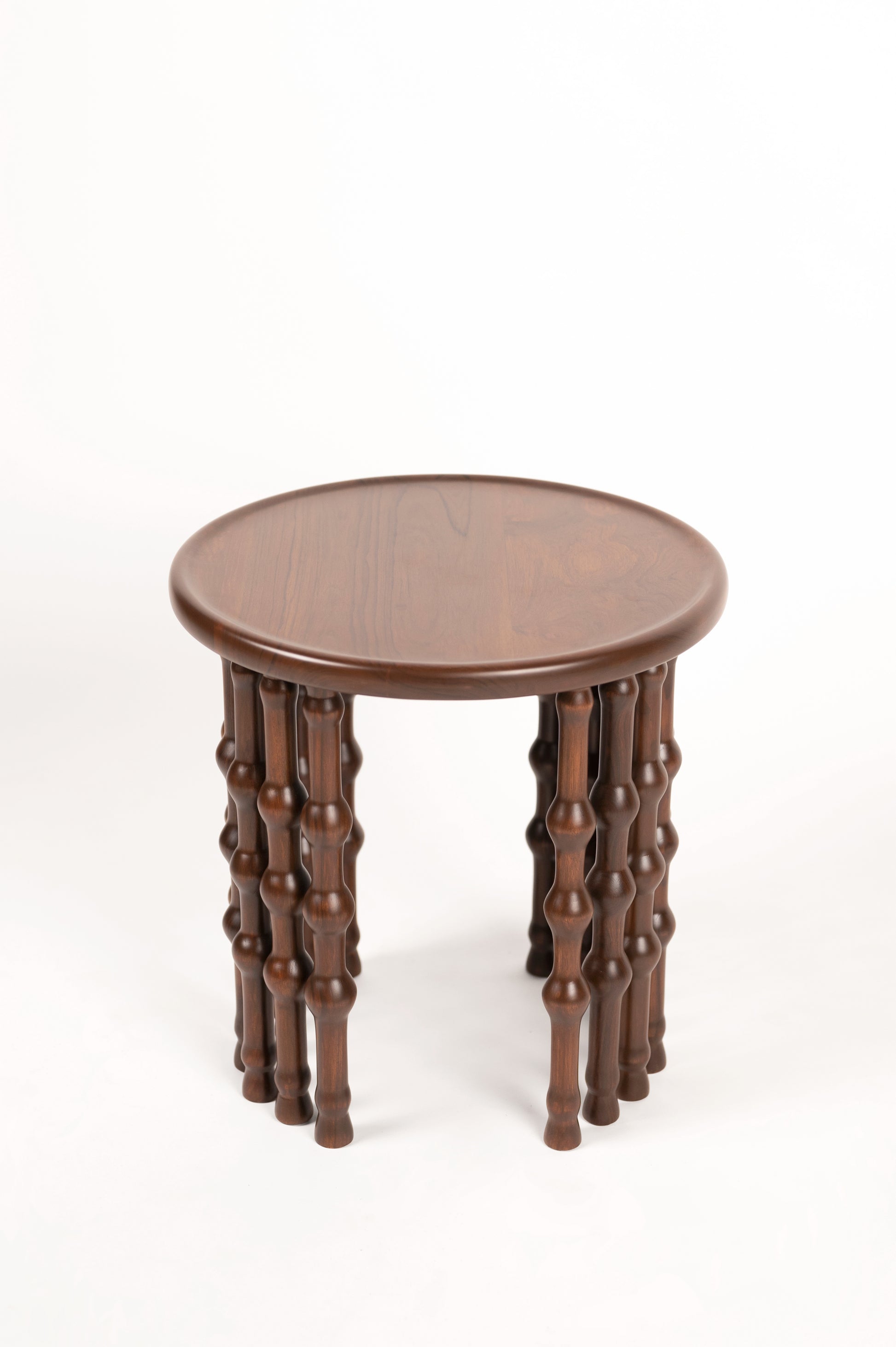 Arcus Side Table — back view of round wooden tabletop and legs