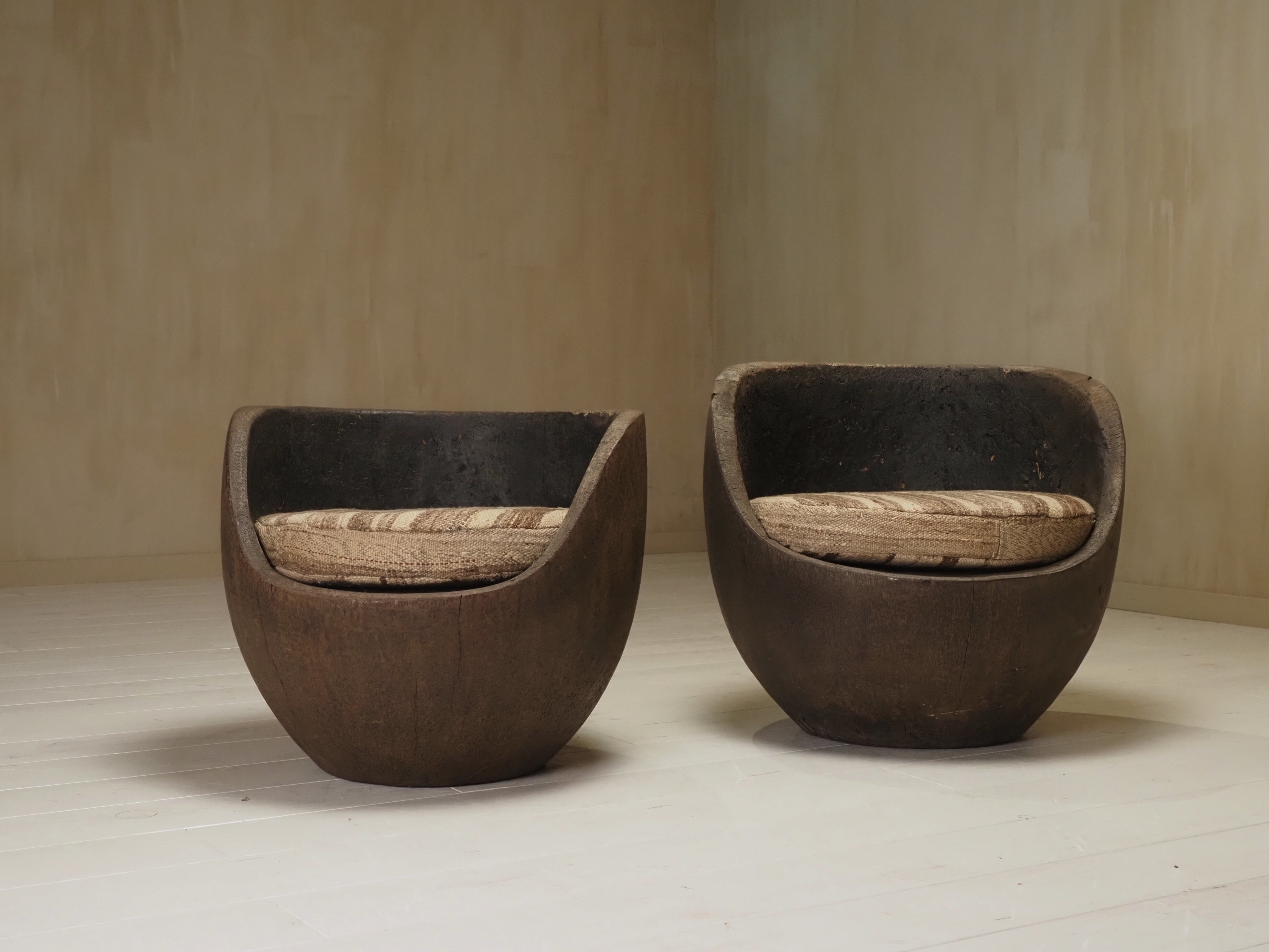 Sculptural mid-century hand-carved pair lounge chairs — detail view