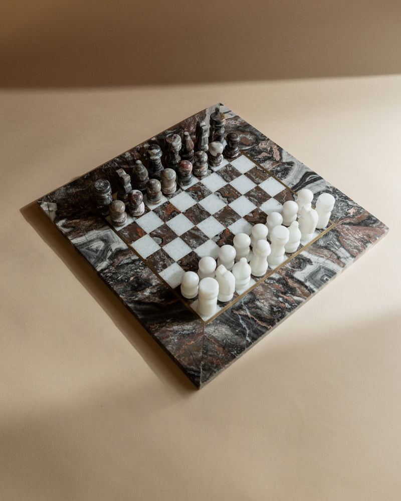 Marble chess set angled view showing carved pieces on stone board