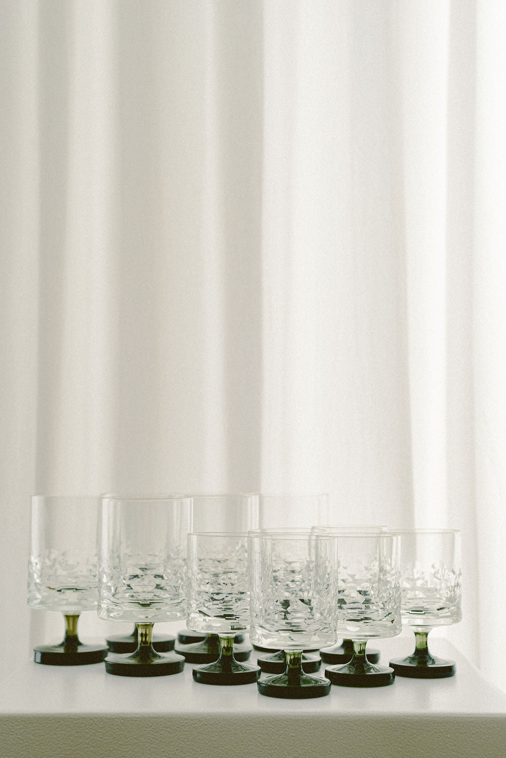 Vintage Ingrid Wine Glasses — close-up of glass texture and brass base