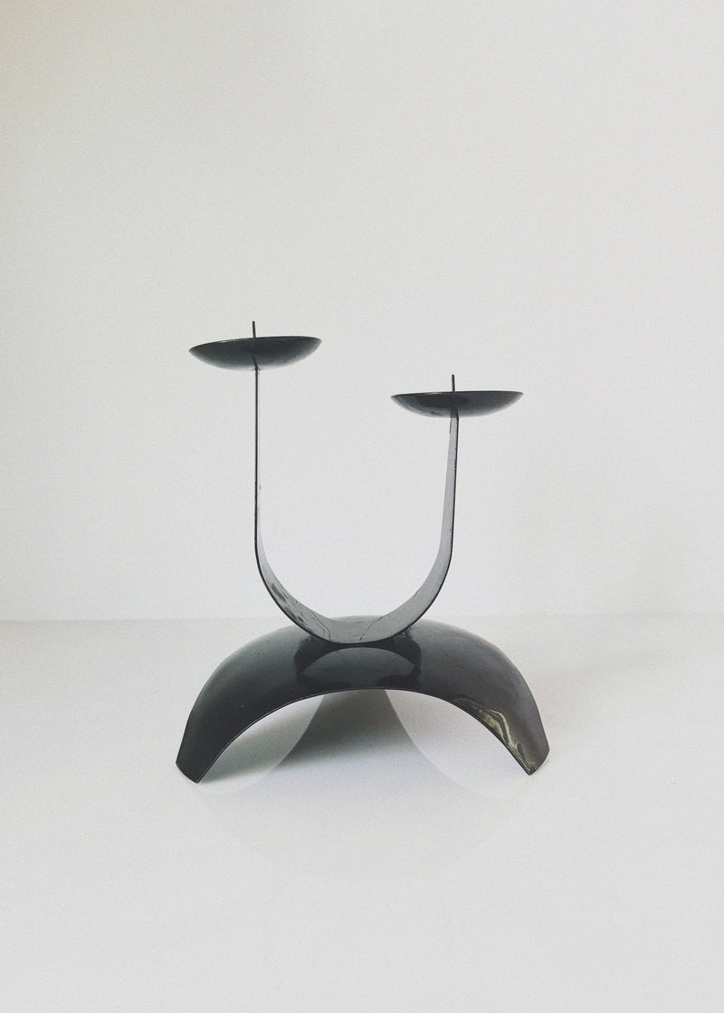 Modern curved metal candleholder with U-shaped design and two candle holders