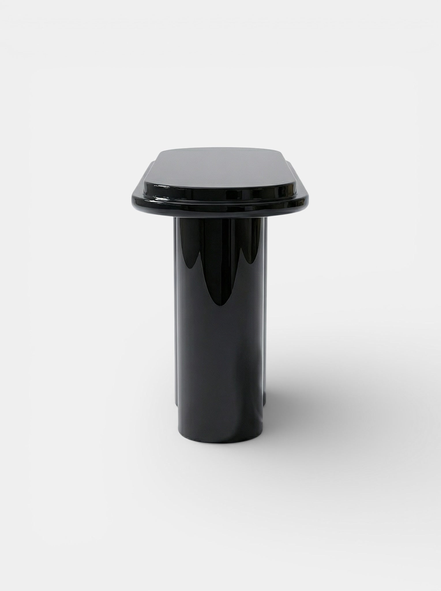 Ida Black Lacquered Wood Console — front view in minimalist setting