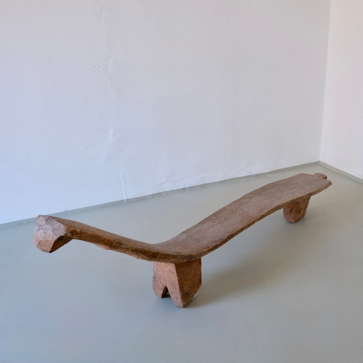 Primitive African Carved Wood Low Sculptural Bench | Vintage — lifestyle setting