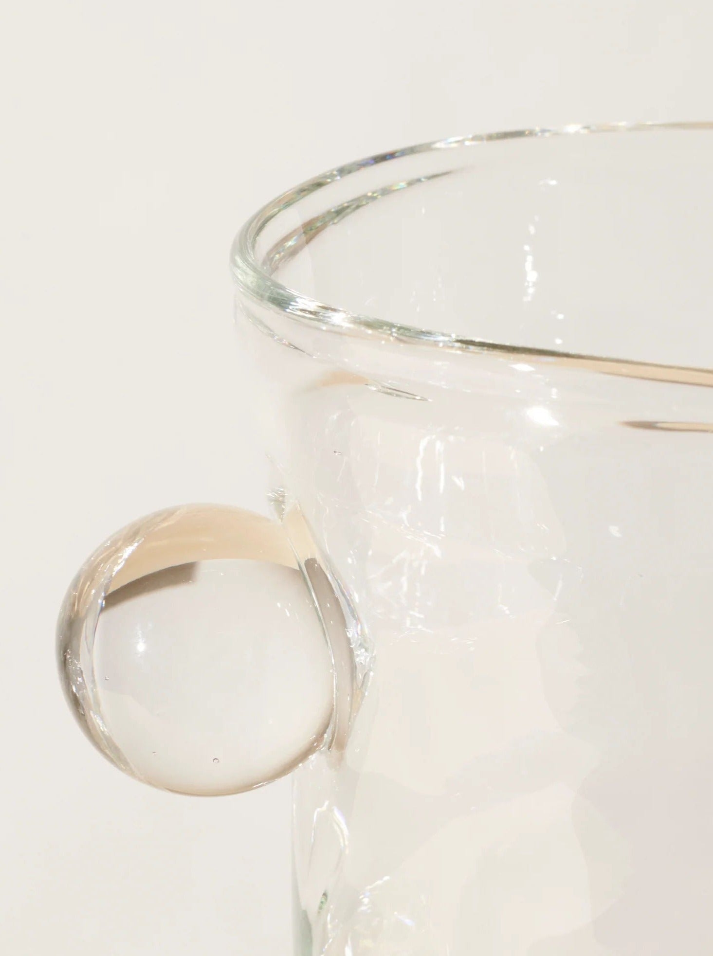 Oliver Vase — close-up of clear glass with rounded handle