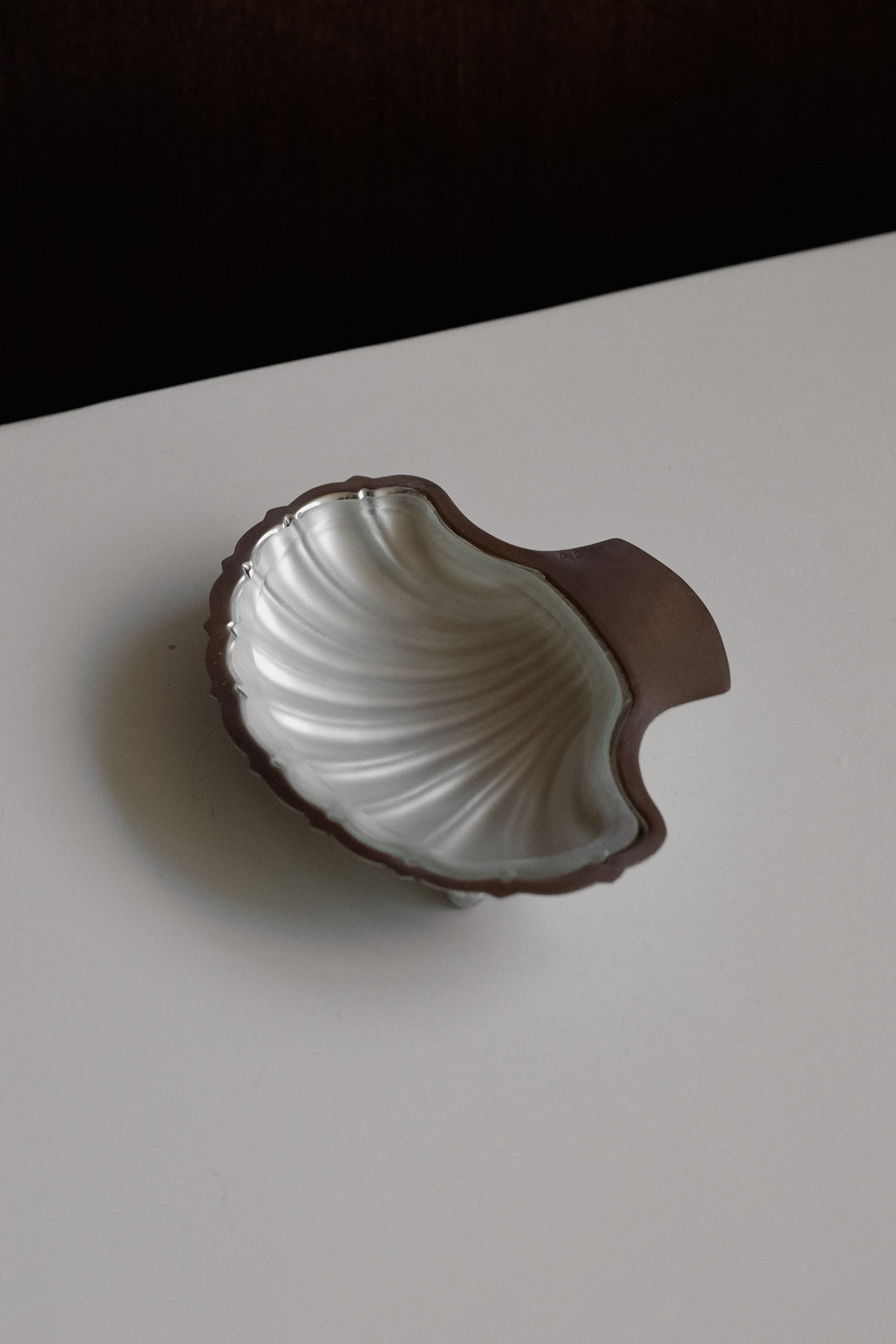 Shell Shaped Butter Dish — back view showing metallic finish and handle
