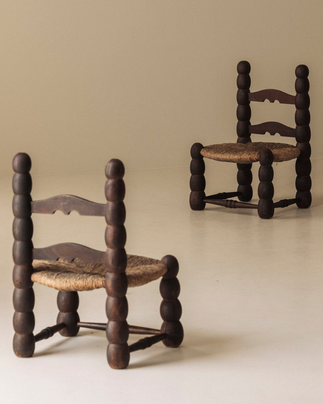 Pair of Spanish Bobbin-Turned Side Chairs with Rush Seats, Early 20th Century — side angle