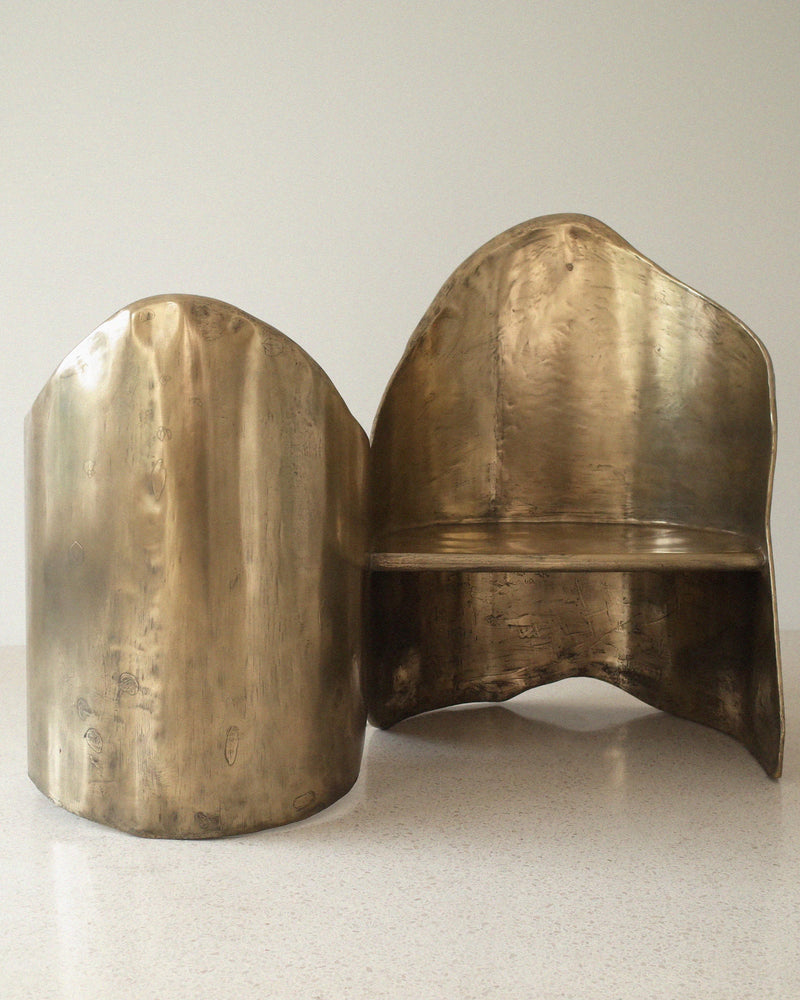 Brass Toi Et Moi loveseat detail view showing curved sculptural form