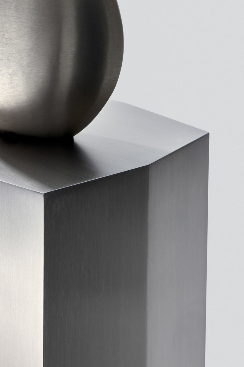 Ame II' Steel Pedestal — close-up of polished steel surface