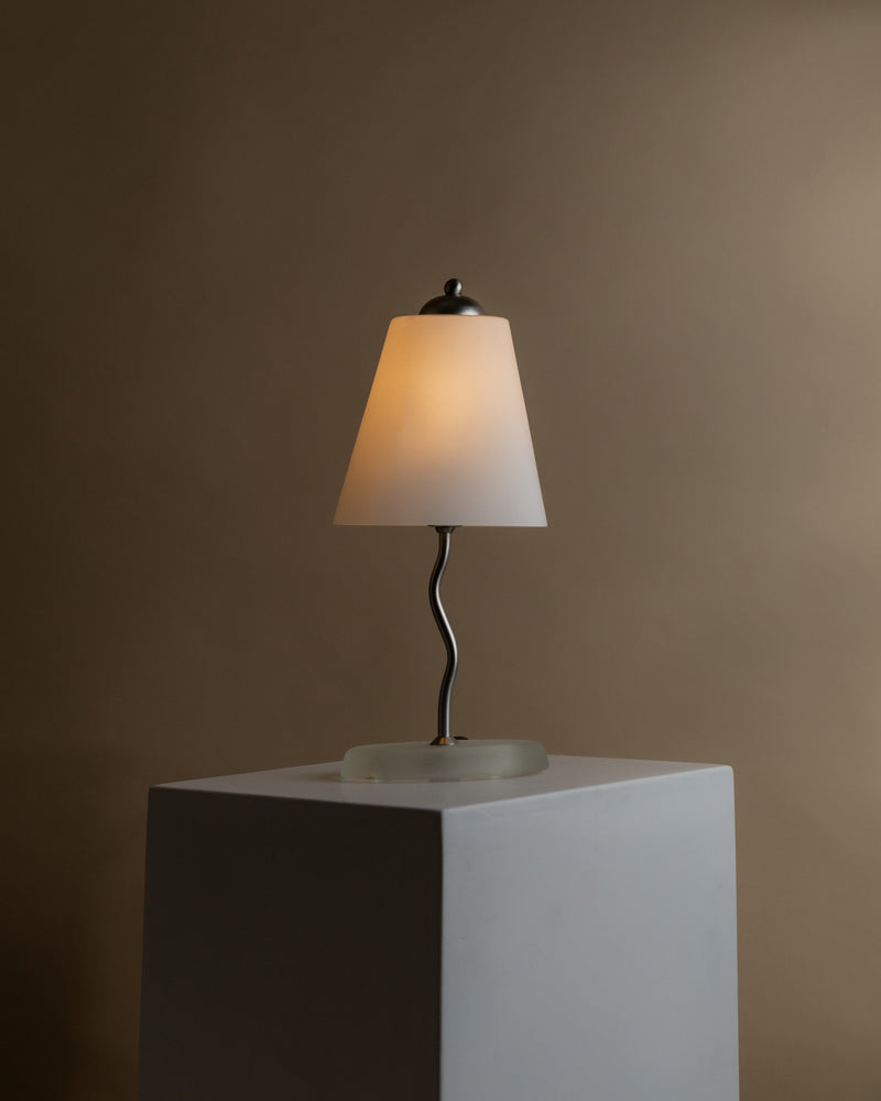 Vintage glass table lamp with zigzag metal stem on white cube