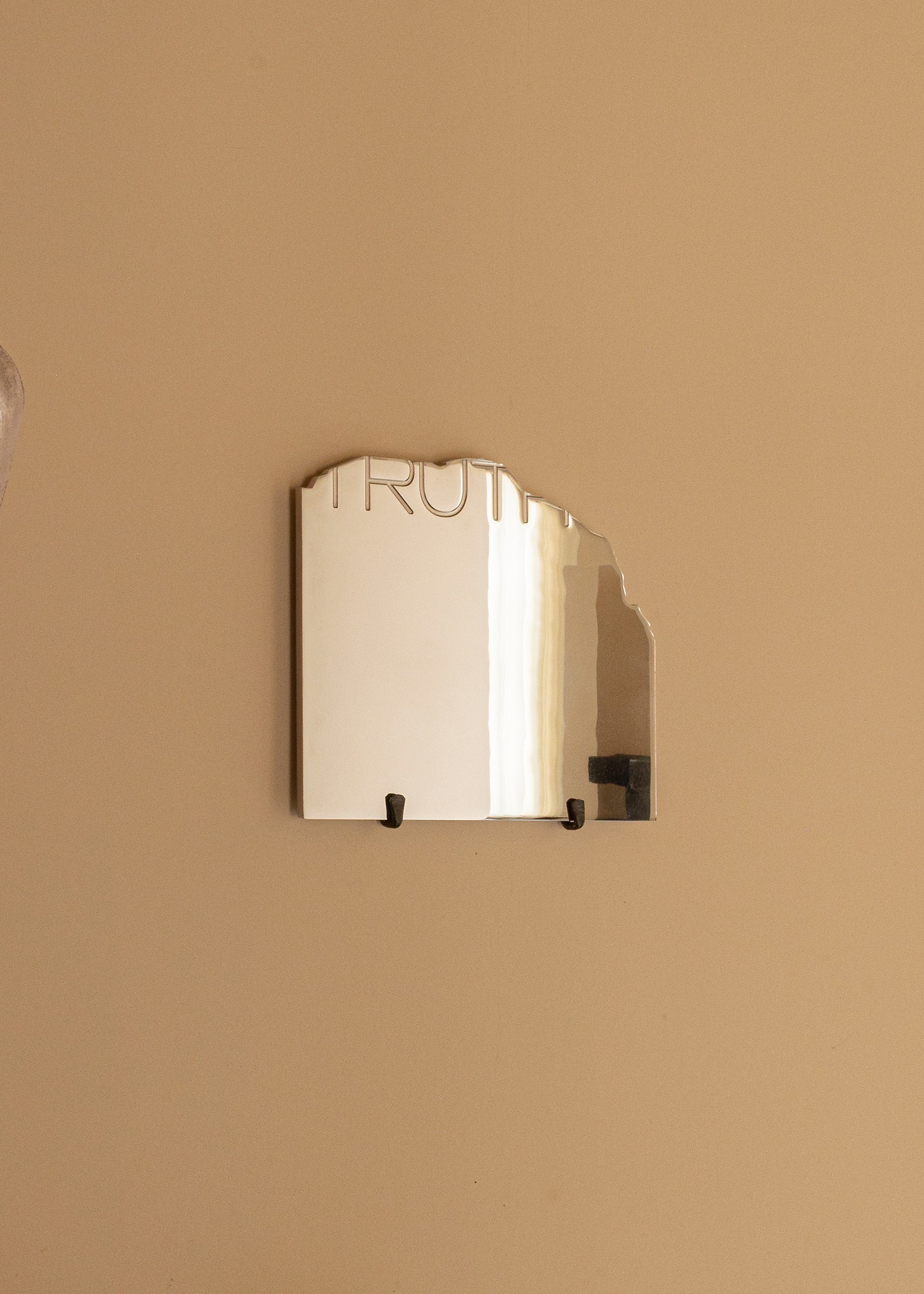 THE TRUTH - Contemporary Mirror — close-up of reflective surface on wall