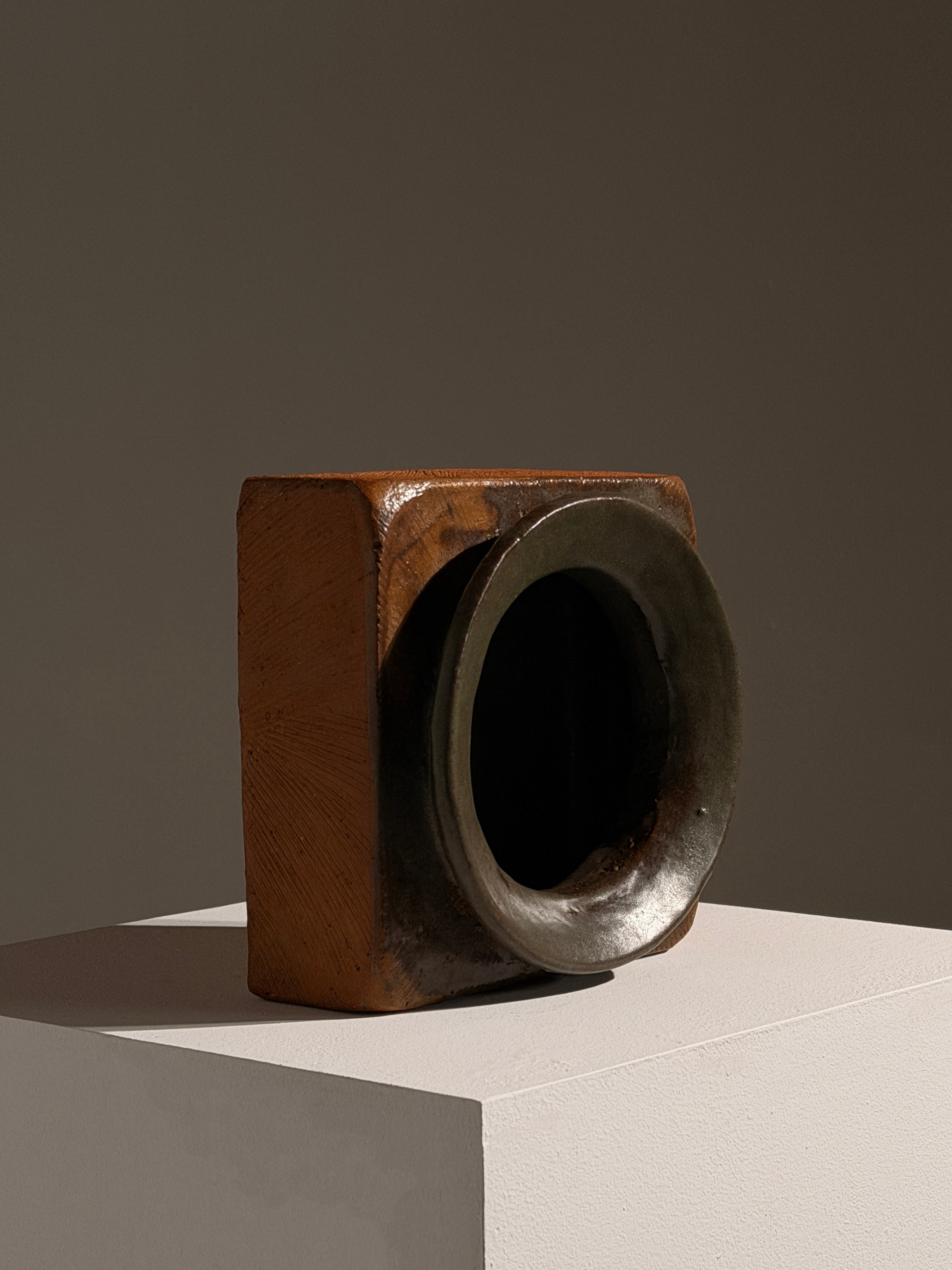 Architectural Stoneware Vase Attributed to Pierre Culot — angled view on white pedestal
