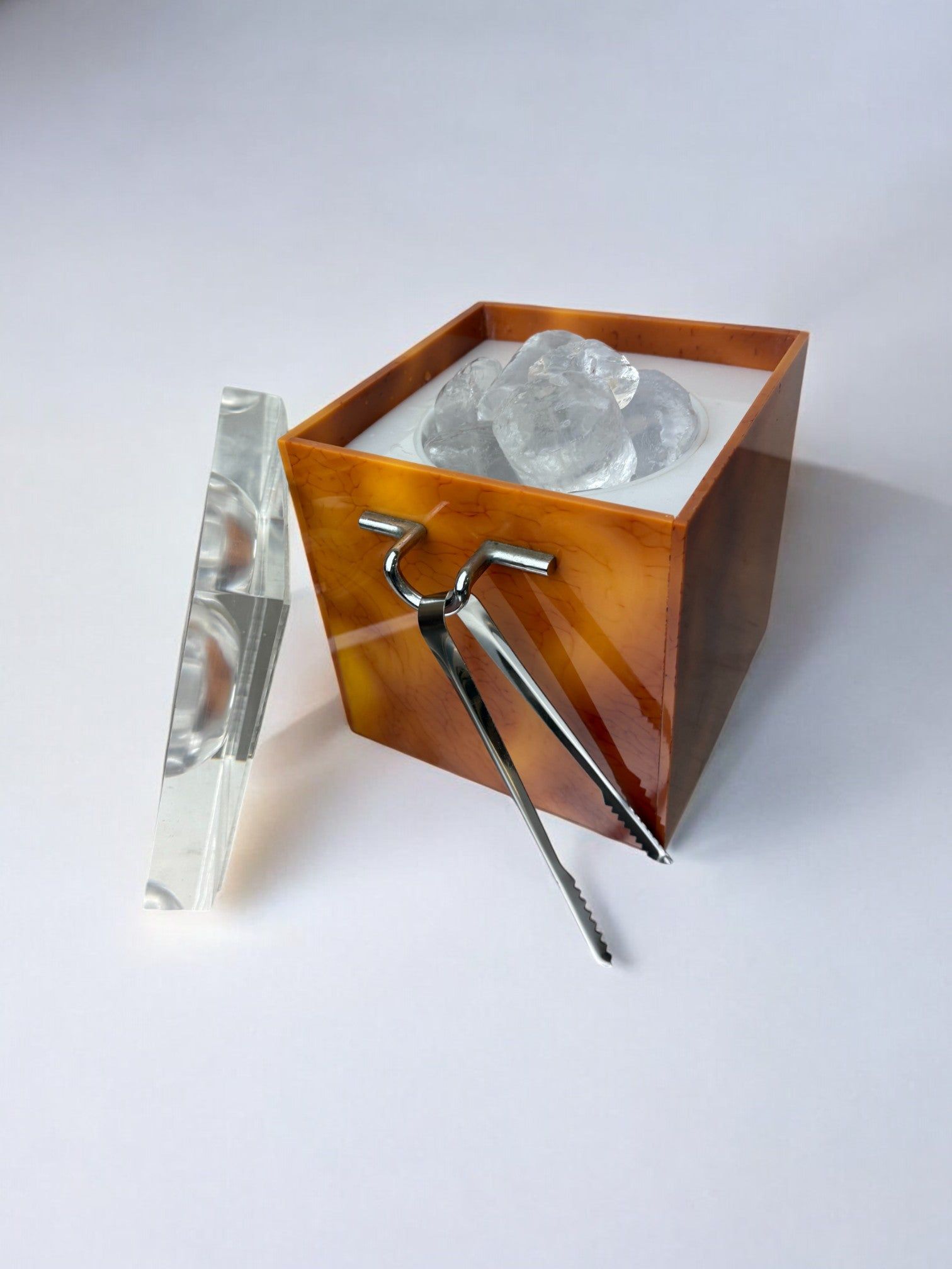 Faux Tortoise Shell Ice Bucket with tongs, Italy, 1970s — side angle showing ice and tongs