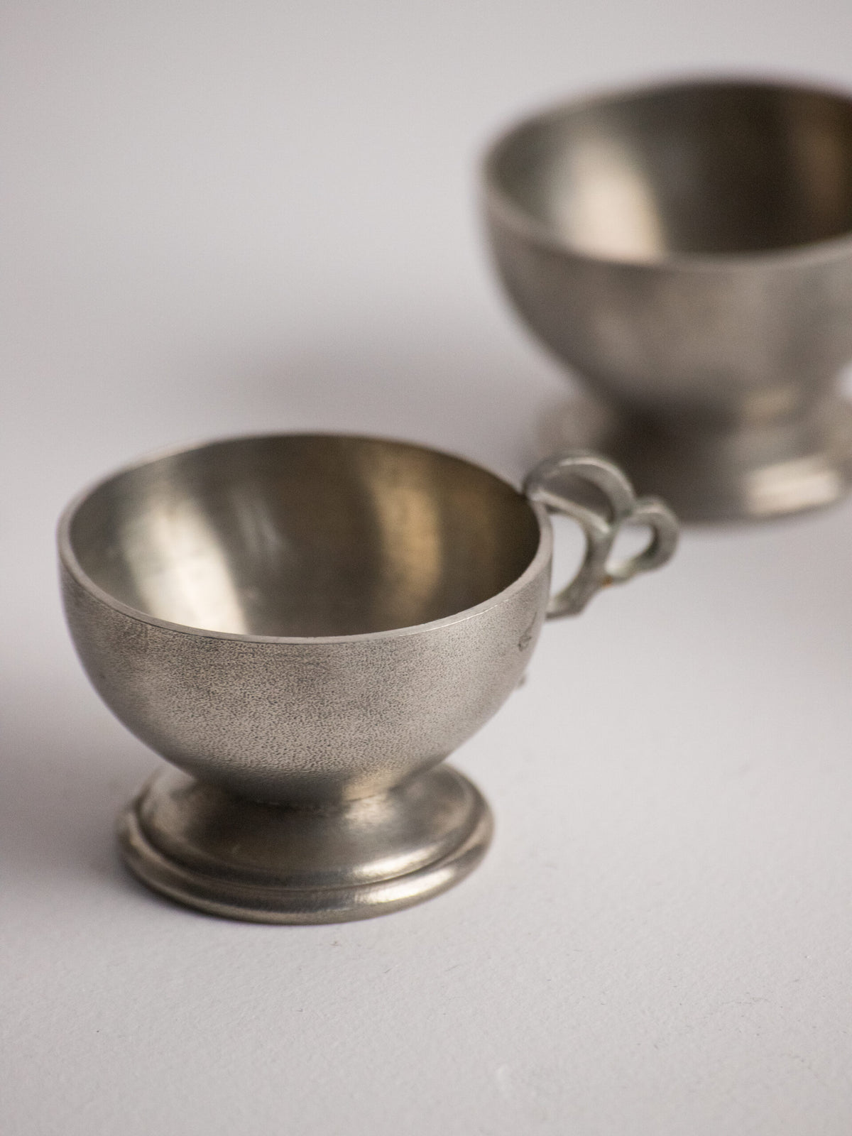 Six Footed Pewter Punch Cups, Triple-Loop Handles, Sweden 1977 — in context