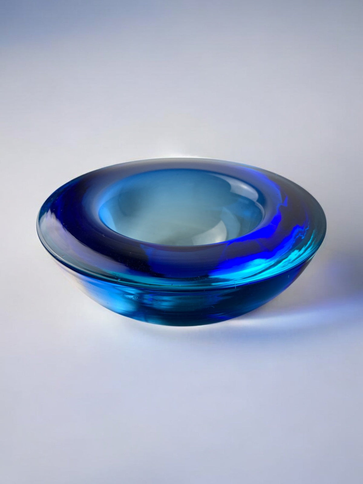 Circular blue Murano glass tray by Flavio Poli — side angle