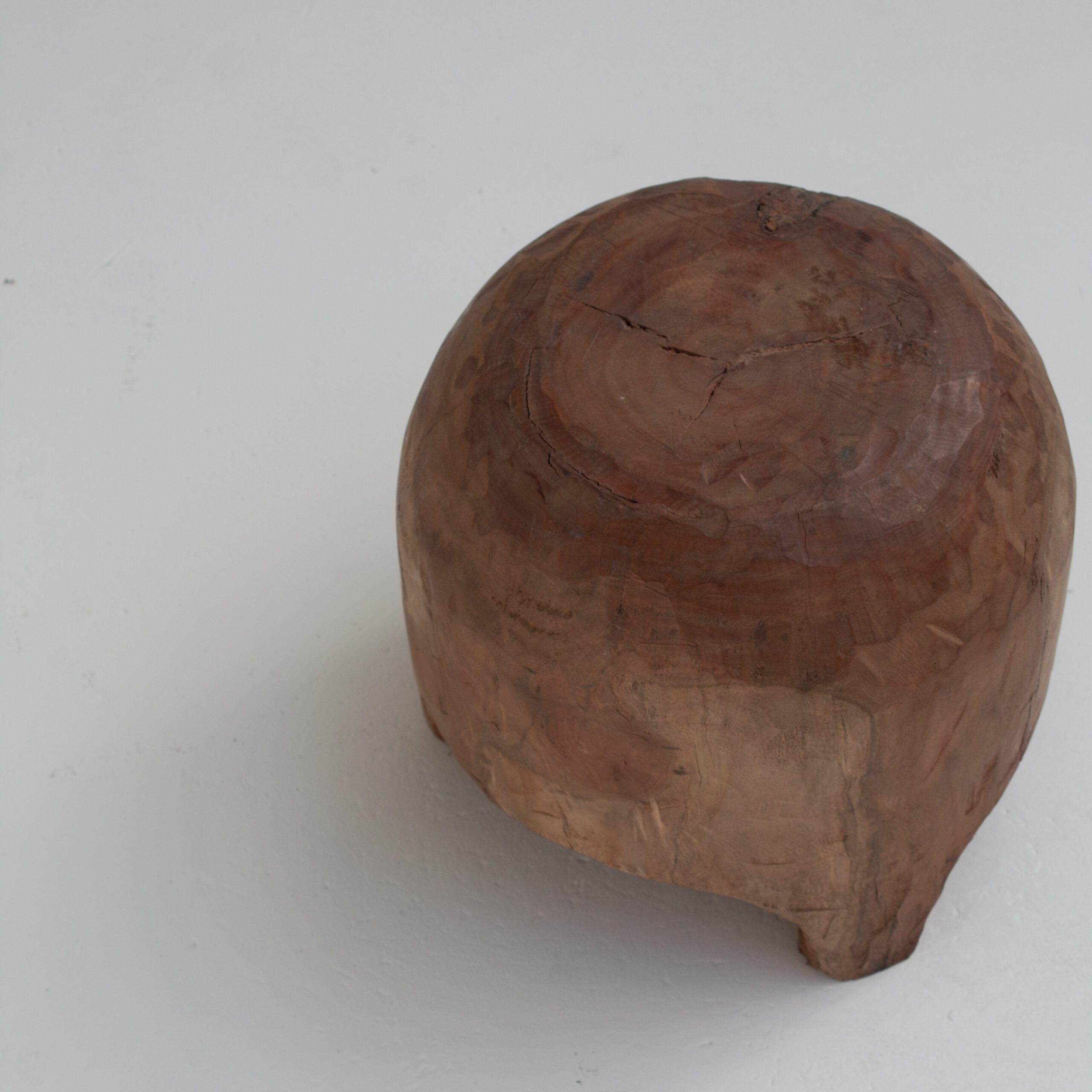 Sculptural Solid Wood Stool in Warm Natural Patina — close-up