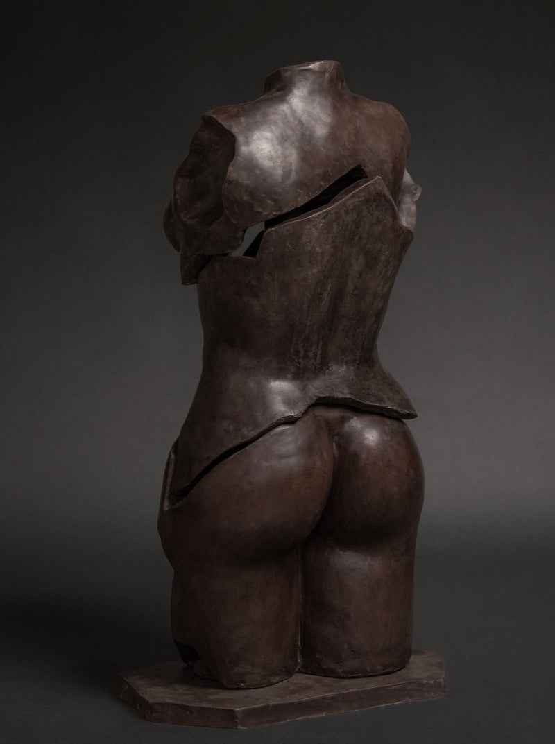 Female Figure Sculpture in Resin and Stone – Fragmentia Triad 03 by Marcela Cure — back view highlighting textured dark surfa