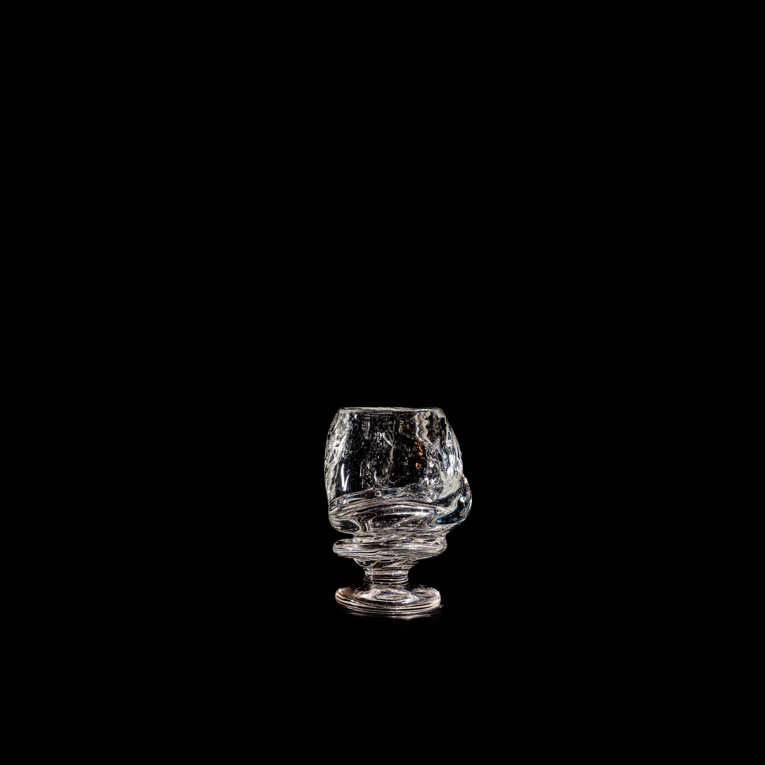 Round Free-shaped Glass — side view on black background