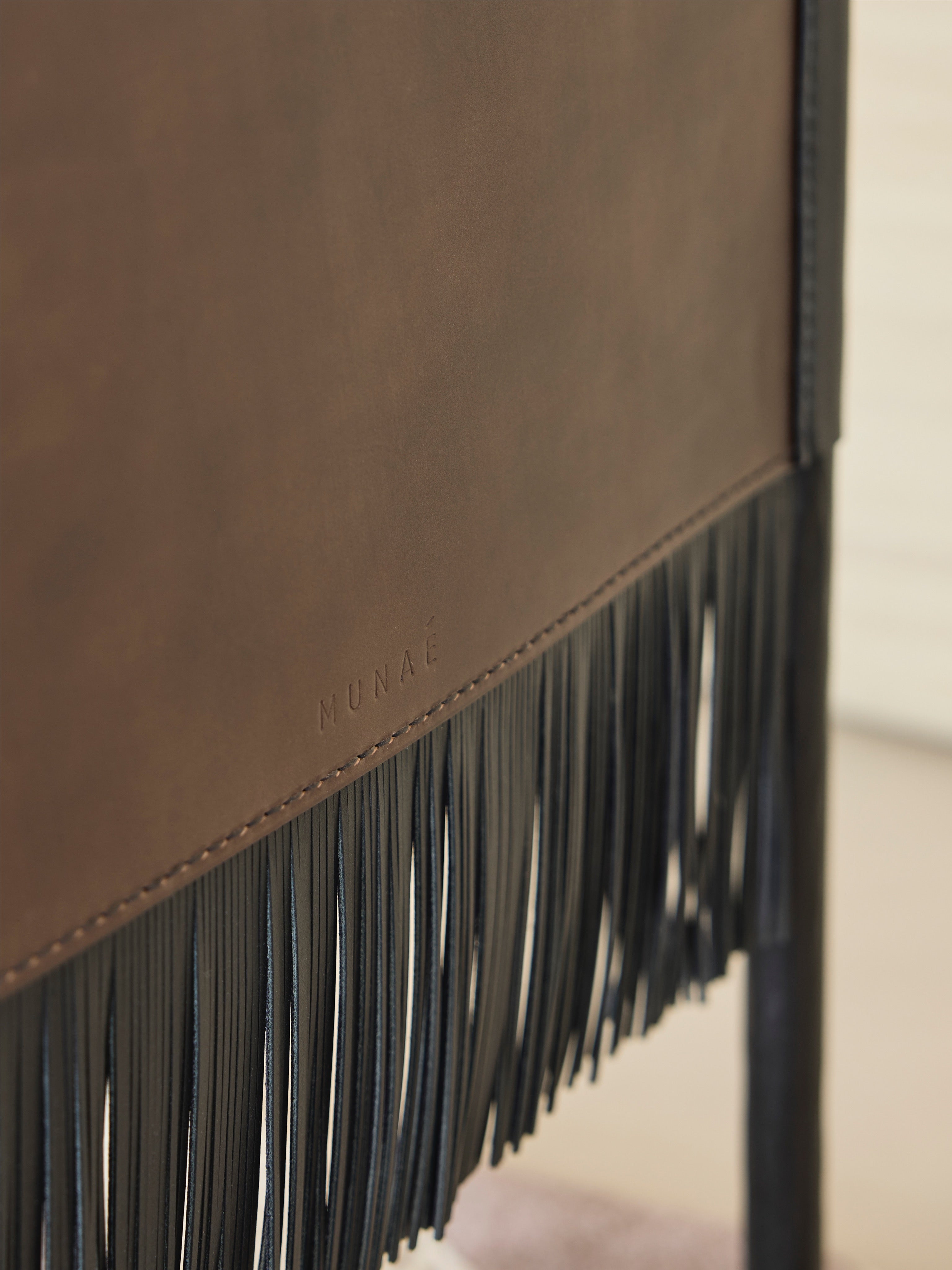 MOON Armchair in Metal and Glass — close-up of leather fringe detail