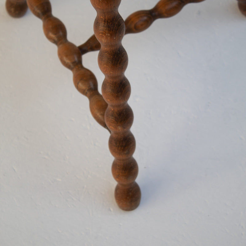 Pair of Vintage Wooden Bobbin Stools — close-up of turned wooden leg detail