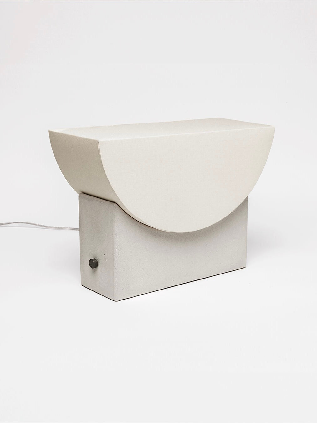 Reminder (001) – Table Lamp – Original — angled view of concrete lamp