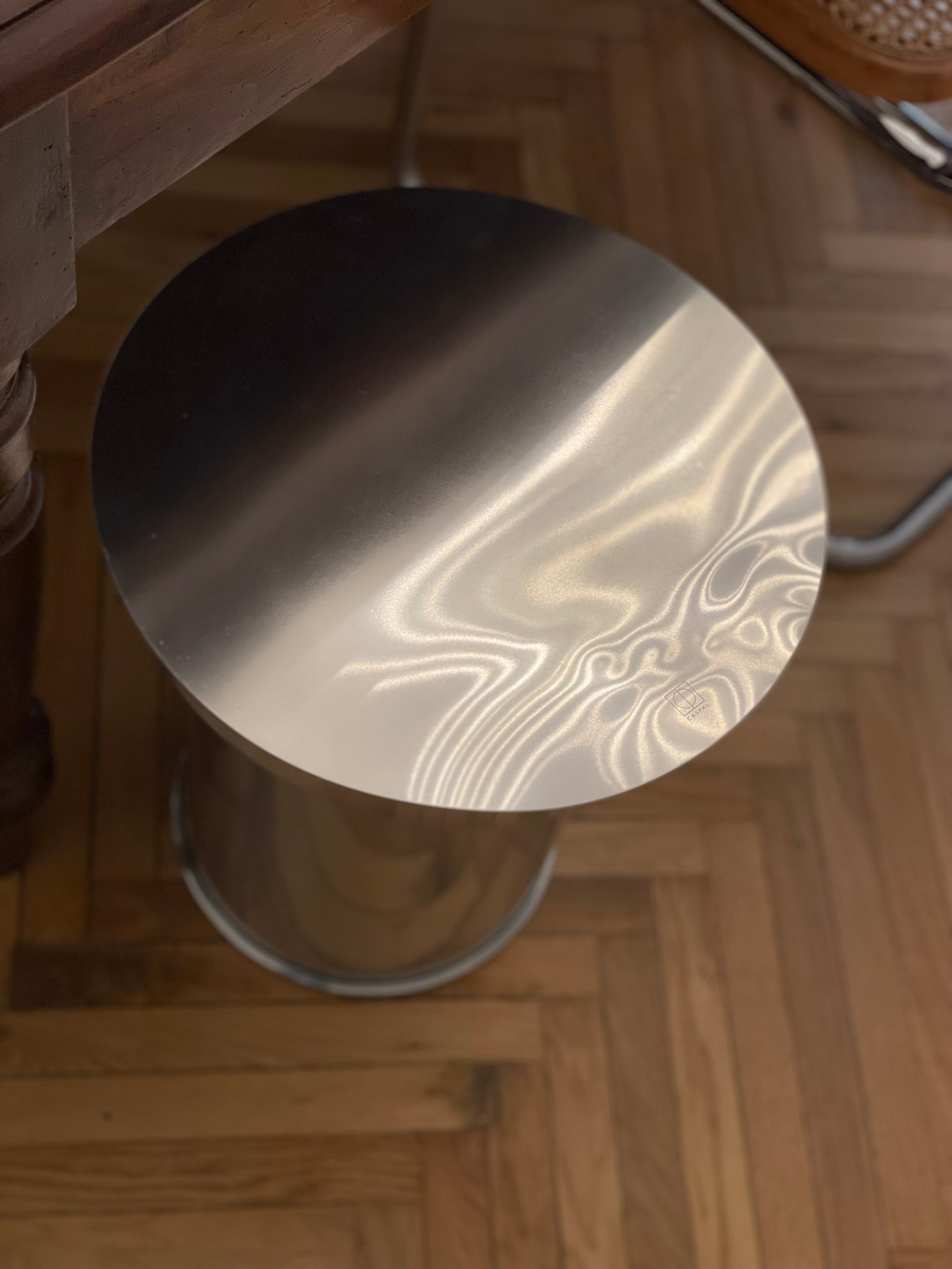 Art Deco Side Table - Mirror-Polished Metal Collection — top view of polished metal surface