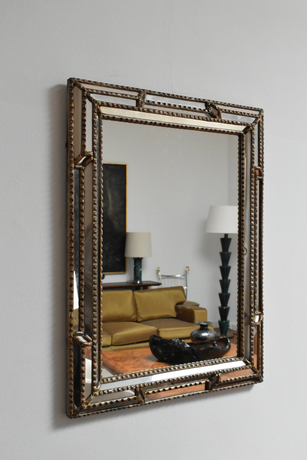 Giltwood and Patinated-wood Mirror, 1940s — angled view reflecting modern living room setting