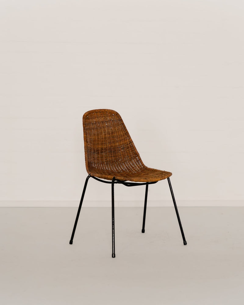 Wicker basket chair with black metal legs by Gian Franco Legler
